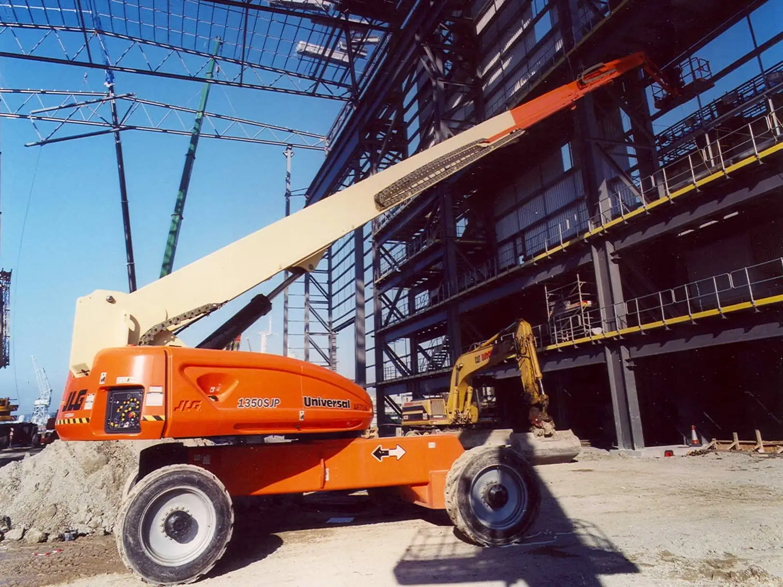 JLG 1350SJP telescopic boom lift on a steel-structure site